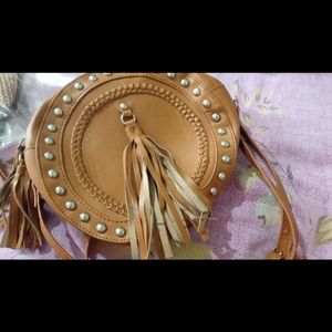 Tan tassel round sling bag